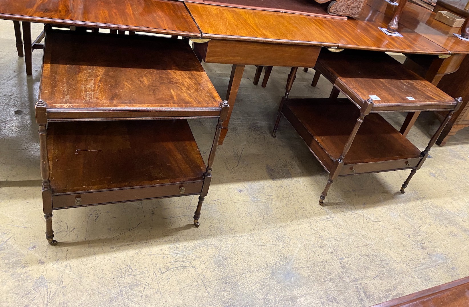 A pair of reproduction George III style mahogany two tier tables, width 56cm, height 60cm